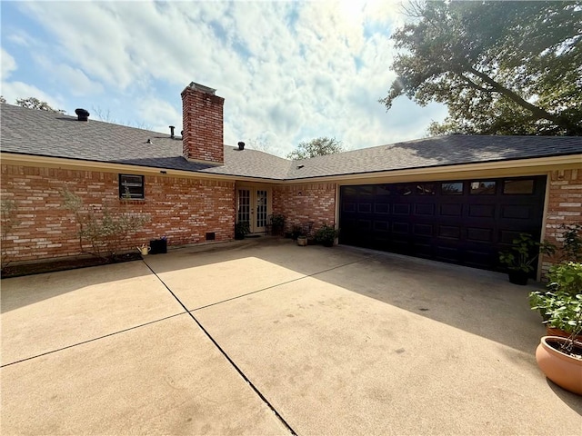 exterior space with a garage