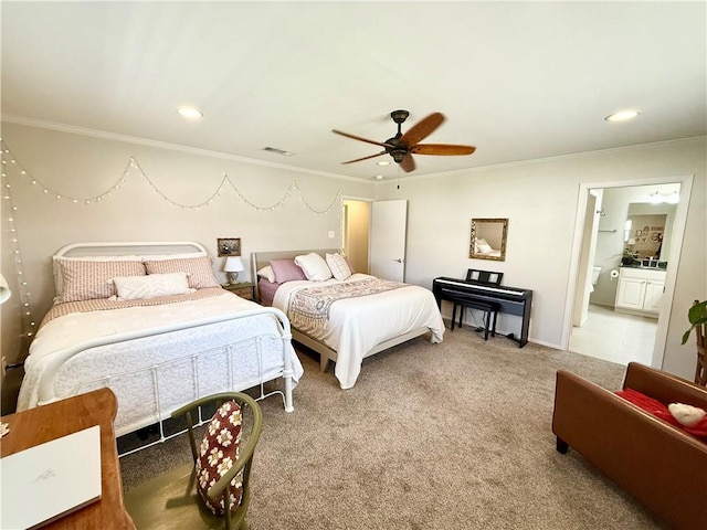 bedroom featuring crown molding, ceiling fan, ensuite bathroom, and carpet flooring