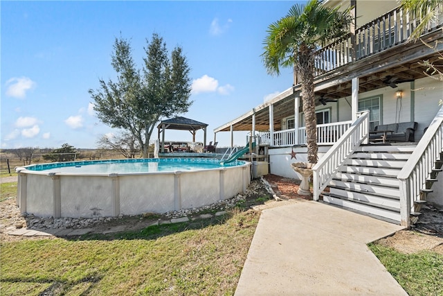 view of pool with ceiling fan