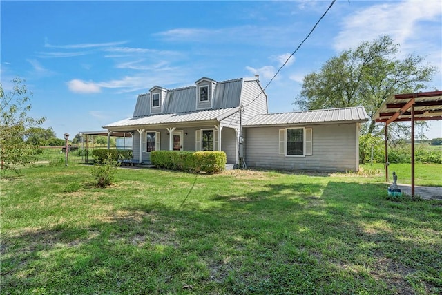 back of property featuring a porch and a yard