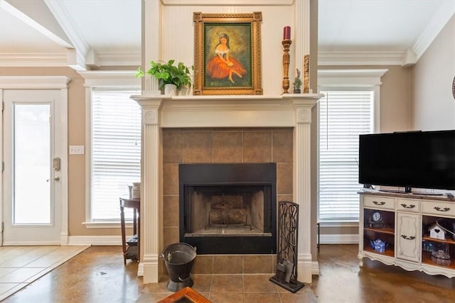 sitting room featuring a fireplace, tile patterned floors, and crown molding