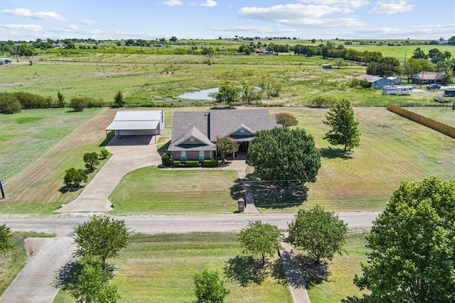 drone / aerial view featuring a water view and a rural view