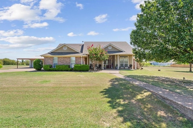 view of front facade featuring a front yard and a carport