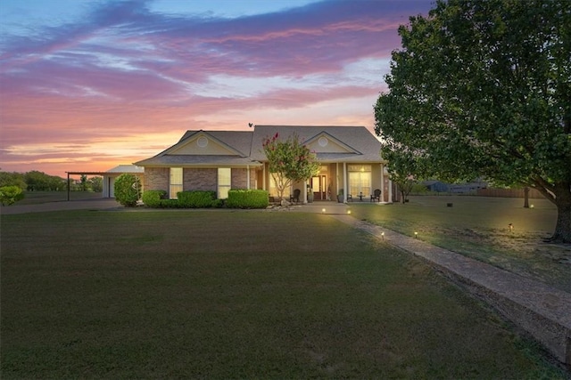 view of front of property with a yard