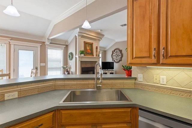 kitchen with decorative backsplash, sink, stainless steel dishwasher, and lofted ceiling