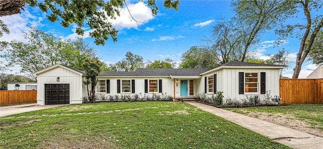 ranch-style home with a front yard and a garage