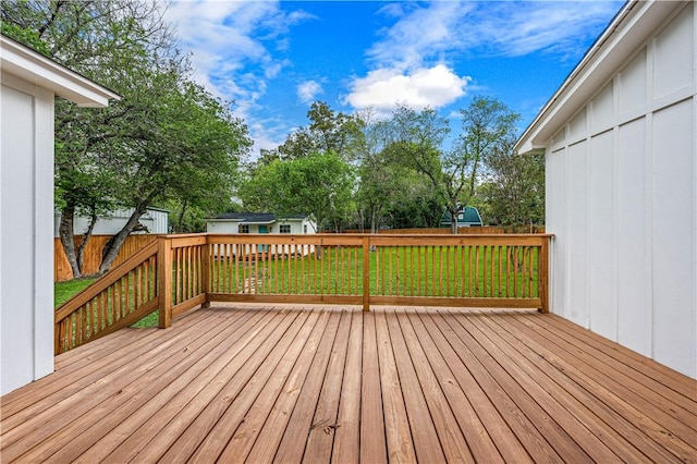 wooden terrace with a yard