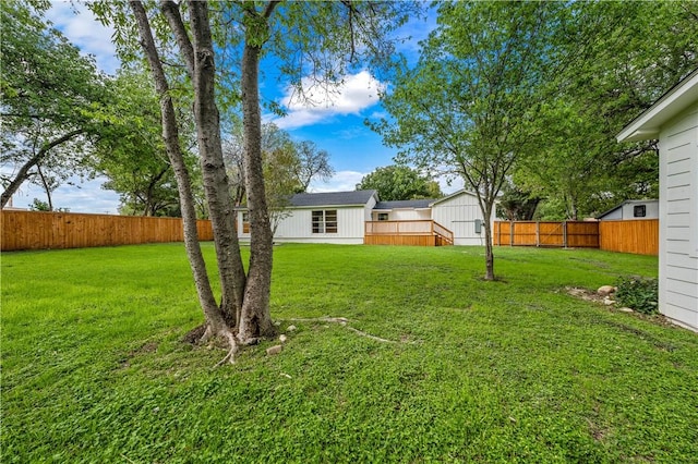 view of yard featuring a wooden deck