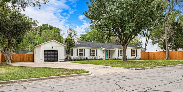 single story home with a garage and a front yard