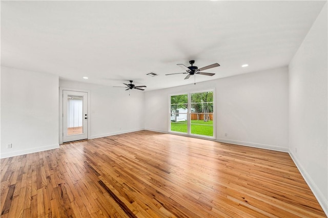 empty room featuring light hardwood / wood-style floors and ceiling fan