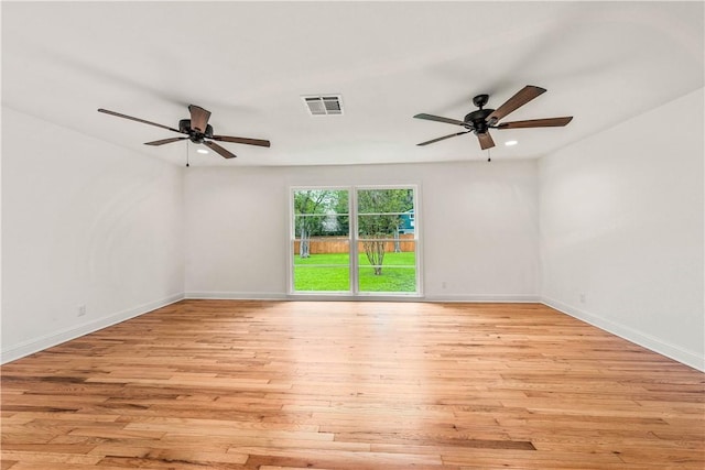 unfurnished room featuring ceiling fan and light wood-type flooring