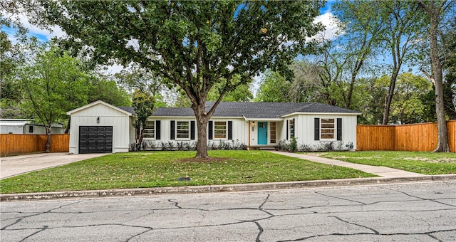 single story home with a front yard and a garage