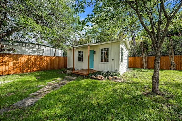 view of outbuilding with a yard