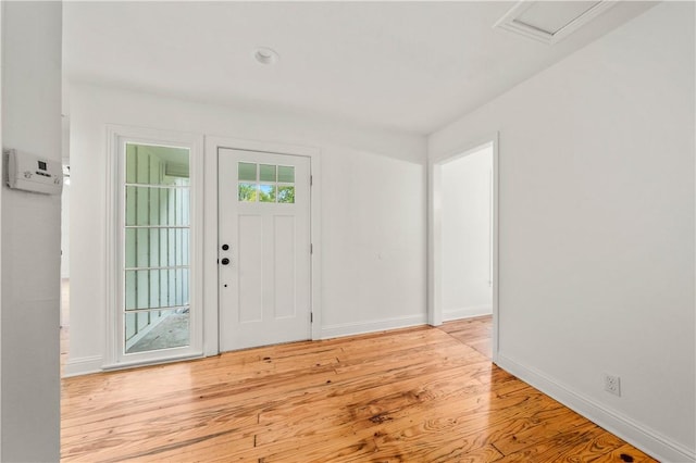 foyer entrance with light hardwood / wood-style flooring