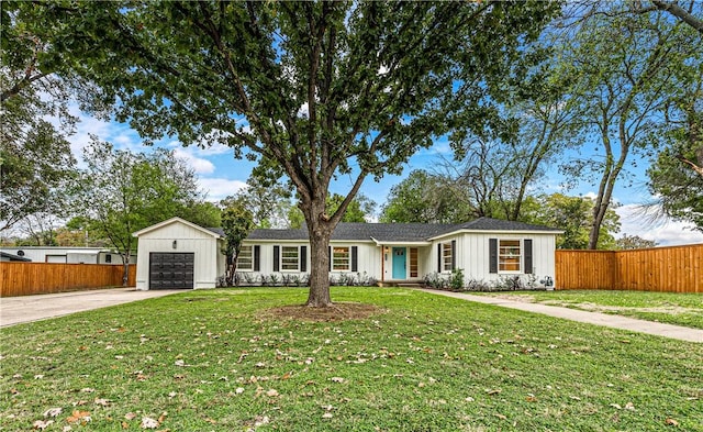 ranch-style house with a front yard and a garage