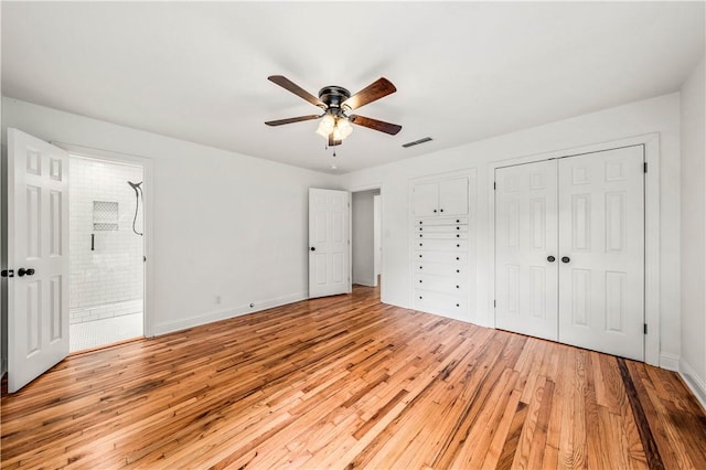 unfurnished bedroom with light wood-type flooring and ceiling fan