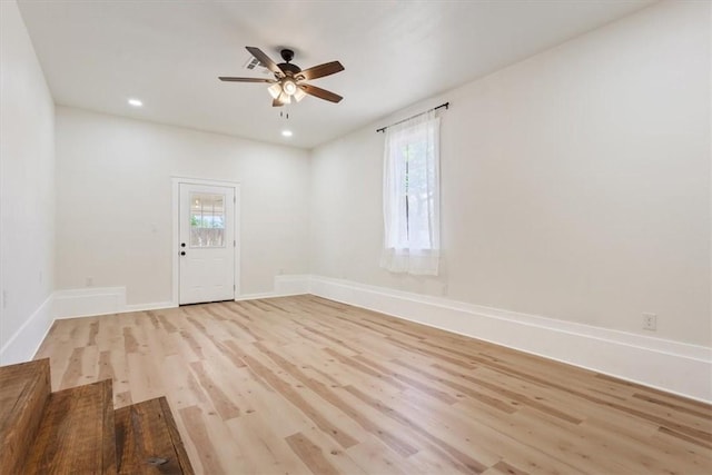 interior space with ceiling fan, a healthy amount of sunlight, and light hardwood / wood-style flooring