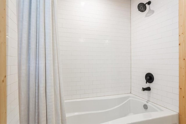 bathroom with shower / bath combination with curtain