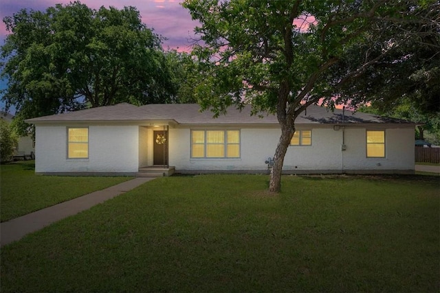 ranch-style house with a yard