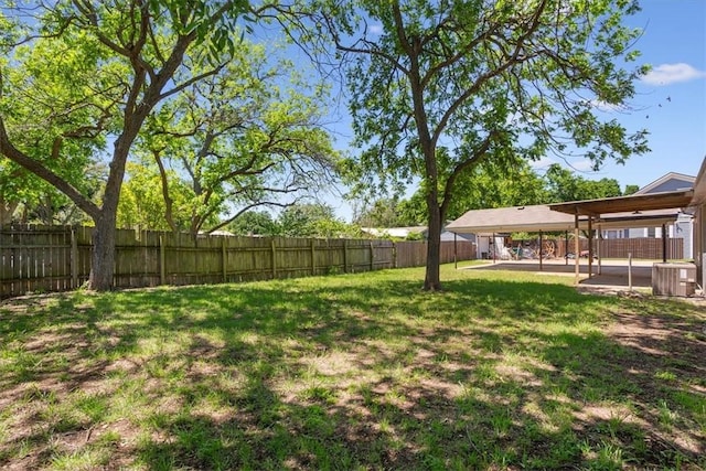 view of yard with central AC unit and a patio area