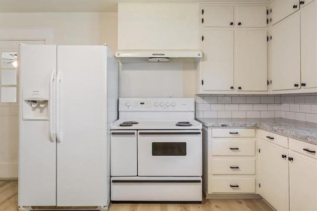 kitchen featuring decorative backsplash, light hardwood / wood-style flooring, light stone counters, and white appliances