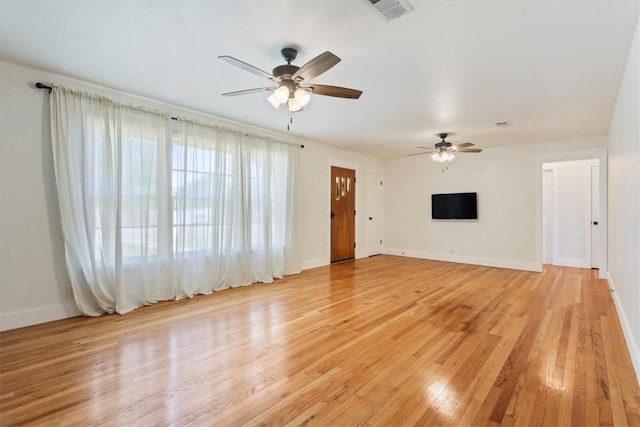 unfurnished living room with light wood-type flooring and ceiling fan