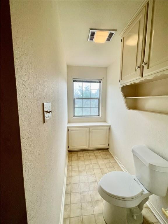 bathroom featuring toilet