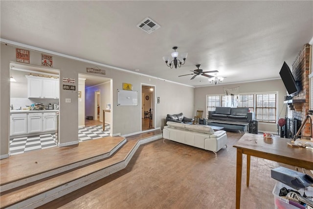 living room featuring crown molding, light hardwood / wood-style flooring, and ceiling fan with notable chandelier