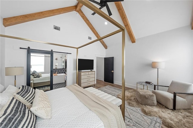 bedroom featuring wood-type flooring, high vaulted ceiling, a barn door, and beamed ceiling