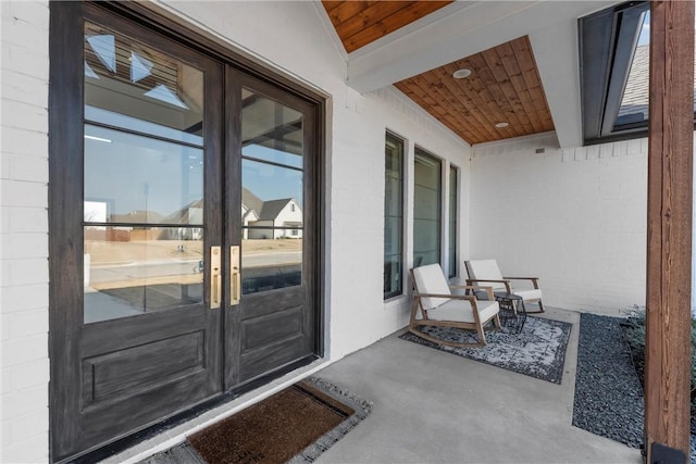 view of exterior entry featuring french doors