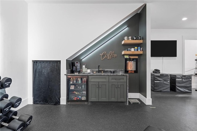 bar with wine cooler, sink, and gray cabinetry