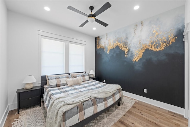 bedroom with hardwood / wood-style flooring and ceiling fan