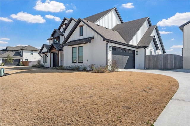 view of front of property featuring a garage and a front yard