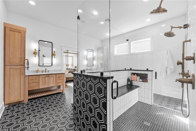 bathroom featuring vanity, tile patterned floors, and walk in shower