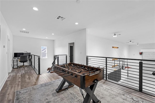 game room with hardwood / wood-style floors