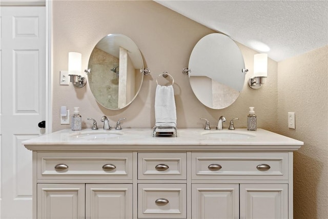 bathroom featuring vanity and a textured ceiling