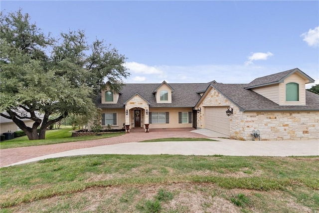 view of front of property featuring a garage and a front lawn