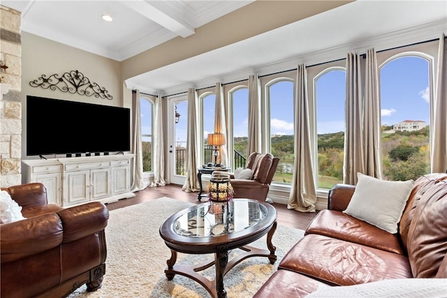 living room featuring hardwood / wood-style floors, ornamental molding, and beamed ceiling