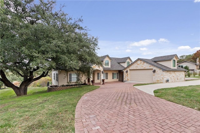 view of front of home with a garage and a front lawn