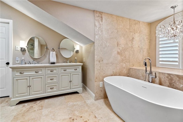 bathroom featuring a washtub, tile walls, vanity, and a chandelier