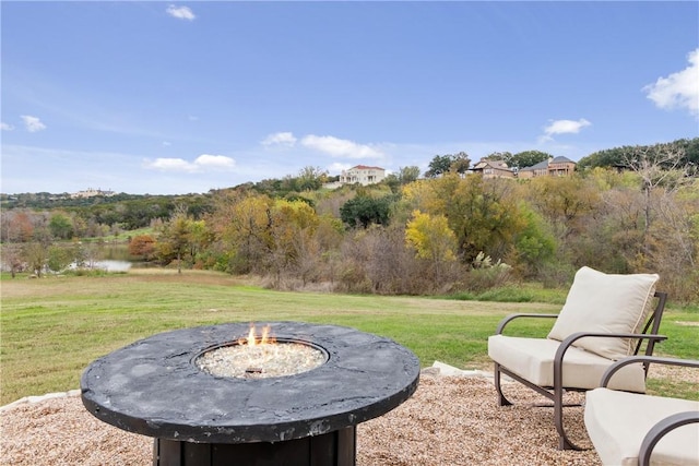 view of yard with an outdoor fire pit