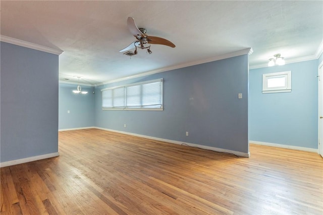 empty room with ceiling fan, ornamental molding, and light hardwood / wood-style flooring