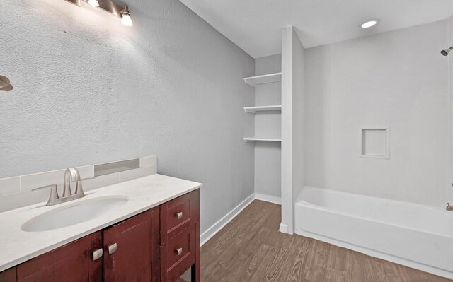 bathroom featuring hardwood / wood-style floors and vanity