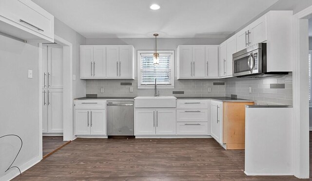 kitchen featuring sink, white cabinets, and stainless steel appliances