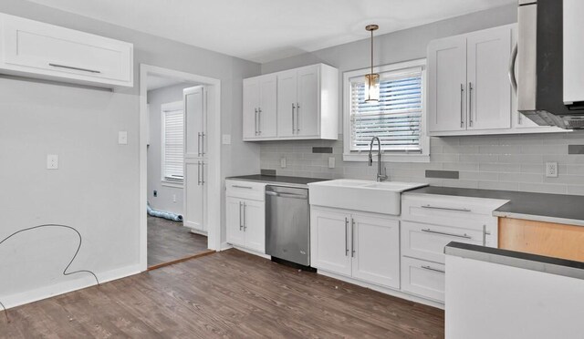 kitchen featuring dishwasher, backsplash, hanging light fixtures, dark hardwood / wood-style flooring, and white cabinetry