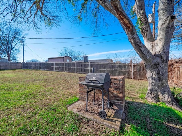 view of yard with a fenced backyard