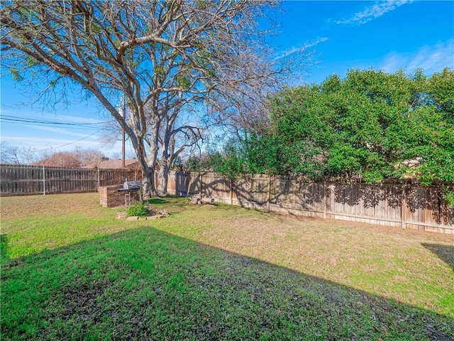 view of yard featuring a fenced backyard