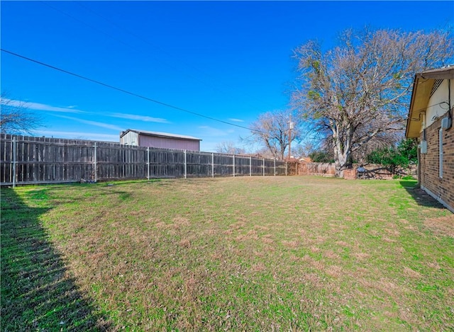 view of yard featuring a fenced backyard