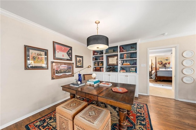 office with hardwood / wood-style flooring and crown molding