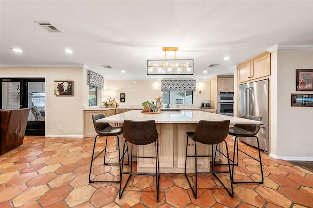 kitchen with pendant lighting, crown molding, appliances with stainless steel finishes, a kitchen breakfast bar, and light brown cabinetry